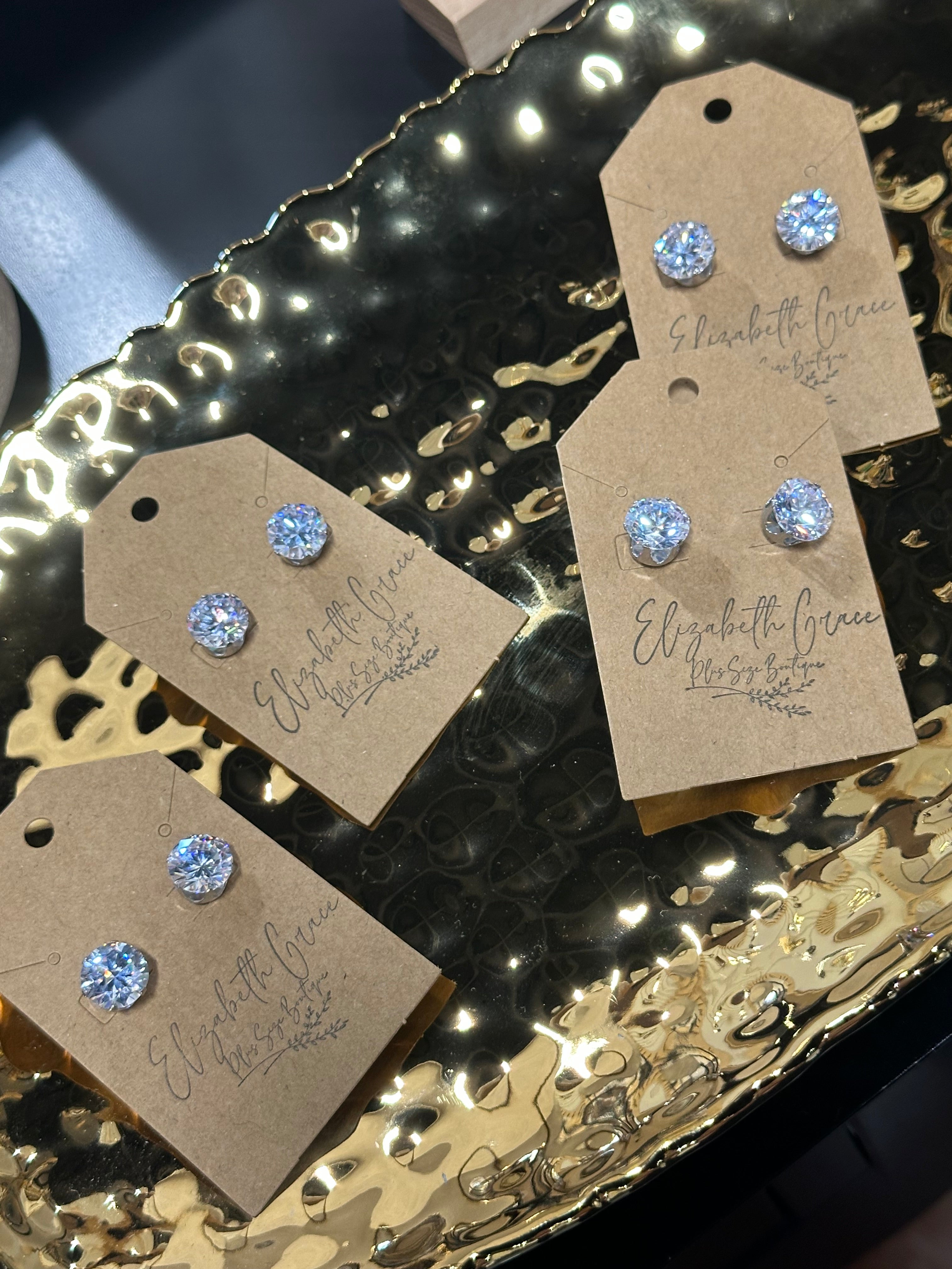 Large white sapphire studs in 18k PVD White Gold