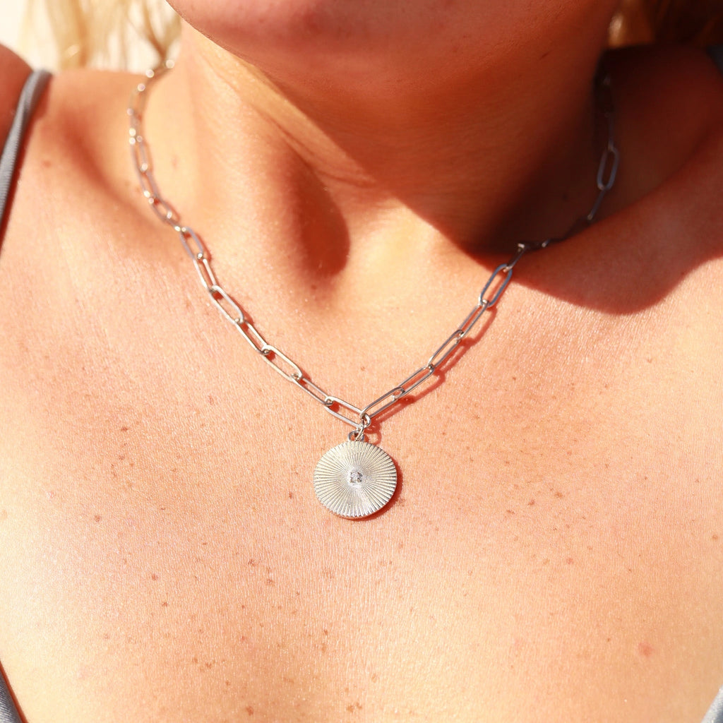 Sunburst circle pendant